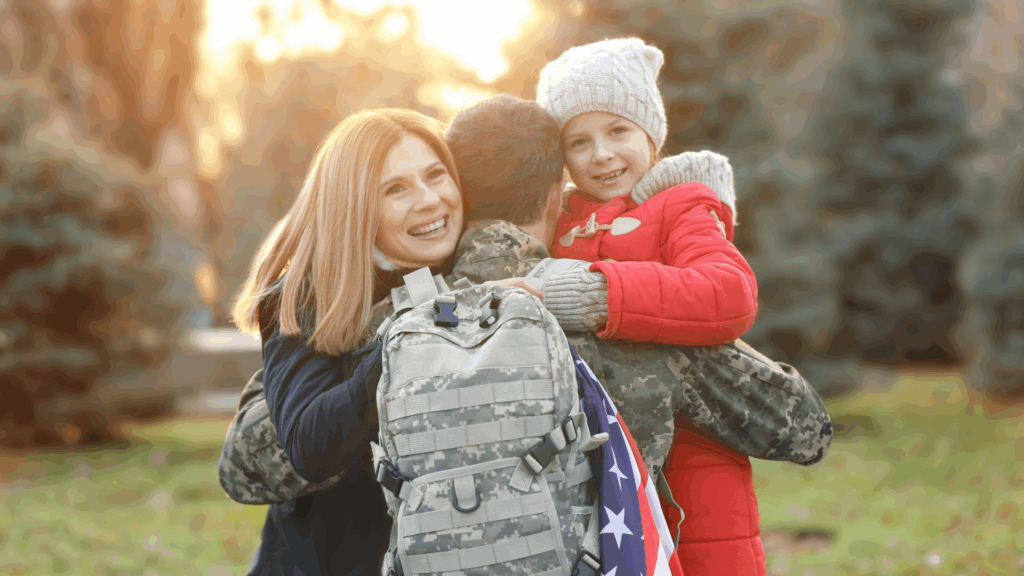 Military family reunion with service member hugging wife and daughter