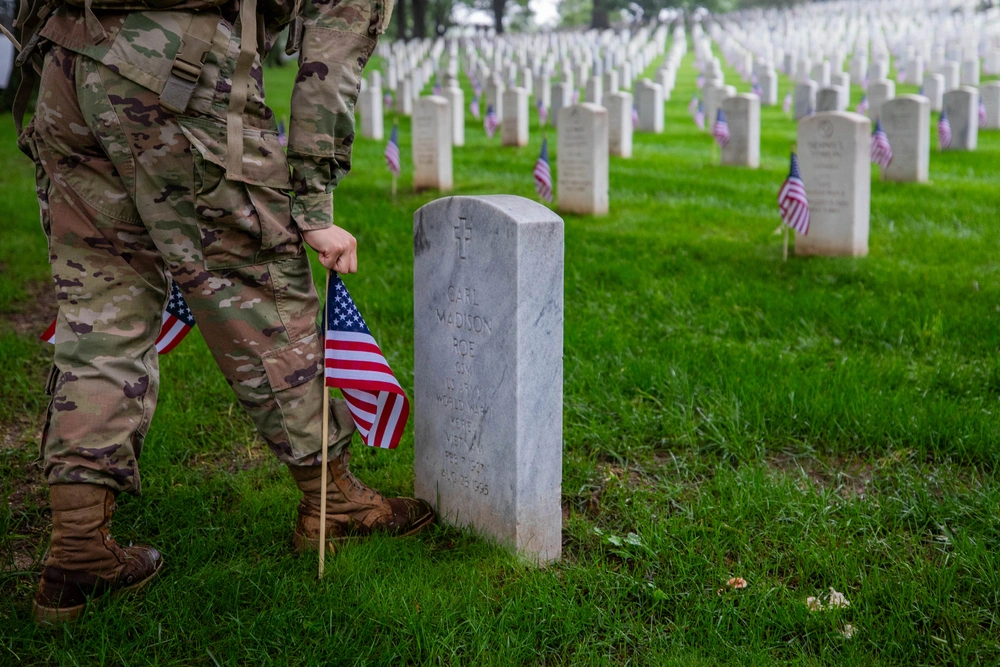 Soldiers of The Old Guard place flags at Arlington National Cemetery for Memorial Day 2025 — Military Appreciation Month 2026 Events guide
