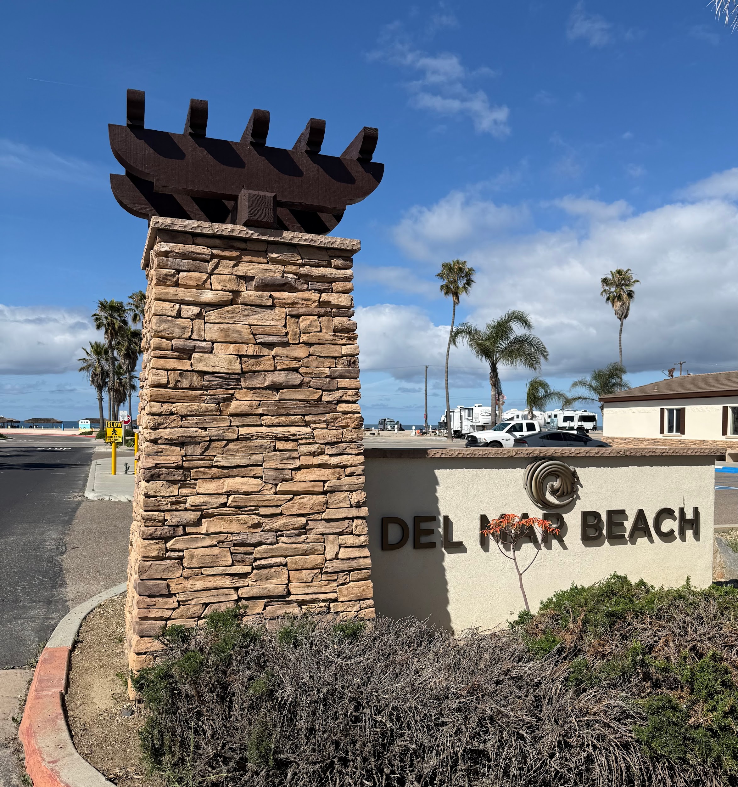 Del Mar Beach Camp Pendleton entrance sign - stone pillar with palm trees