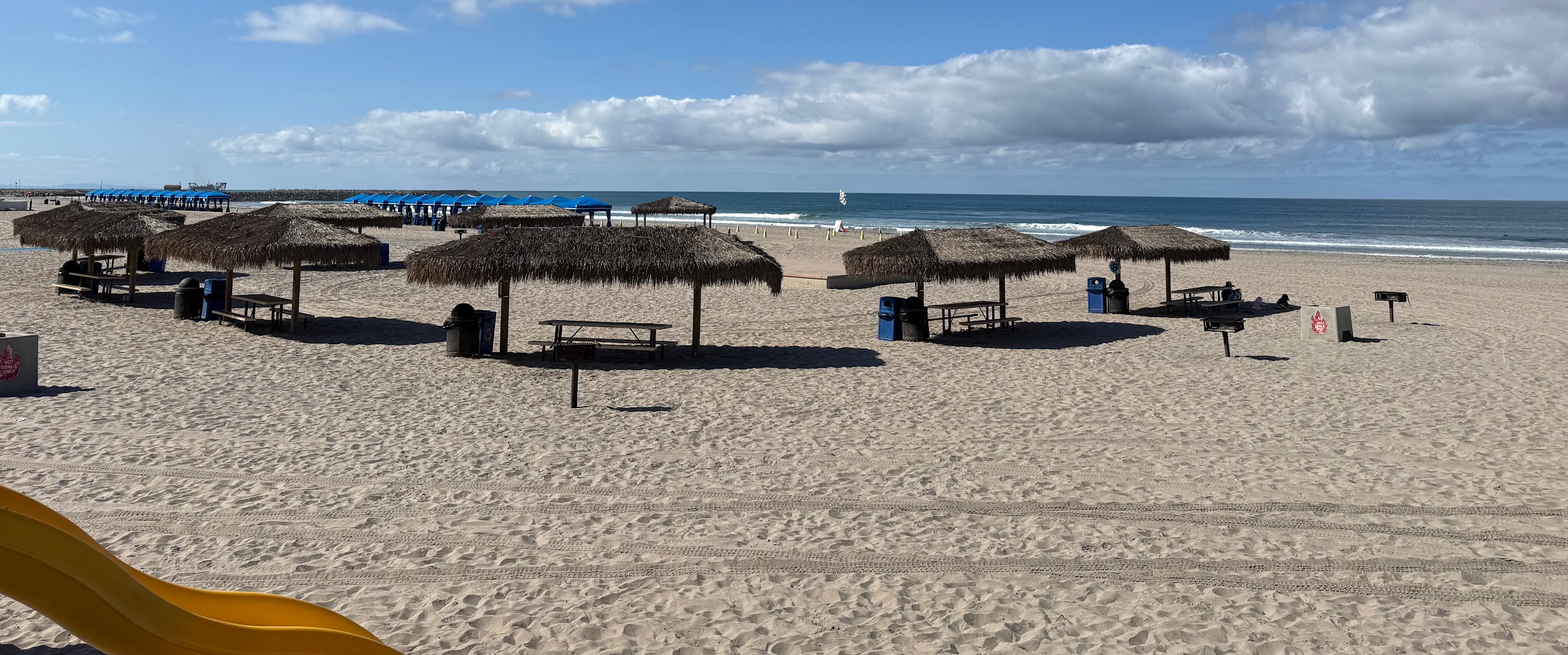 Palapas and picnic shelters on the sand at Del Mar Beach Camp Pendleton